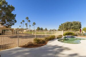 Enjoy the sparkling pool and golf course views at 361 W Beechnut Place.
